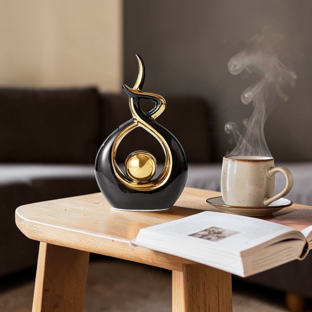 Black and gold abstract ceramic sculpture on coffee table