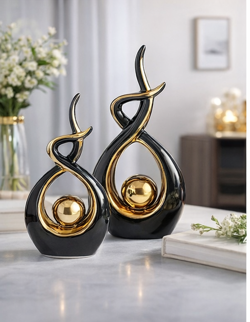 Black and gold abstract ceramic sculptures set of two