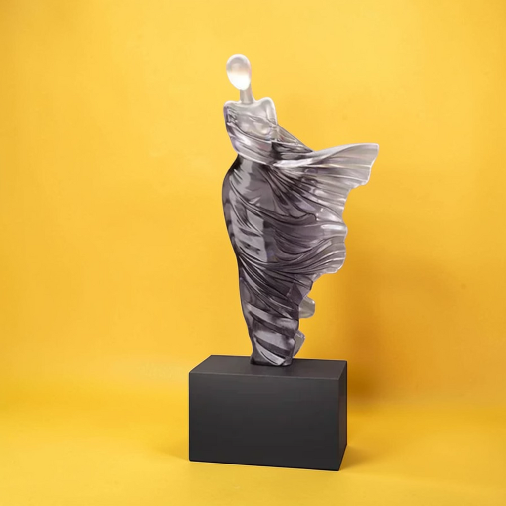 Abstract woman sculpture displayed on shelf