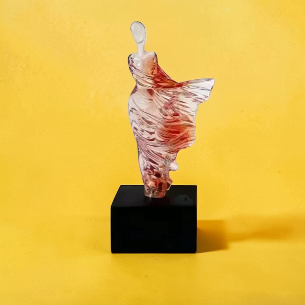 Decorative abstract woman statue with books and plant