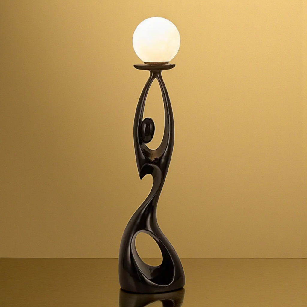Black abstract floor sculpture with globe lamp