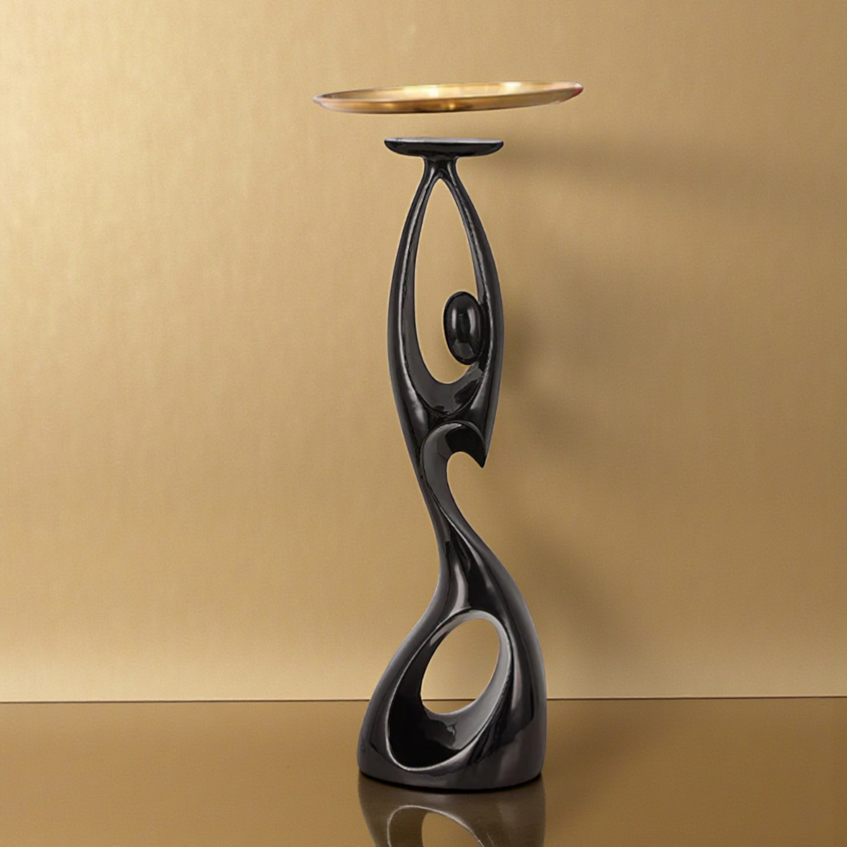 Black abstract floor sculpture with gold tray table
