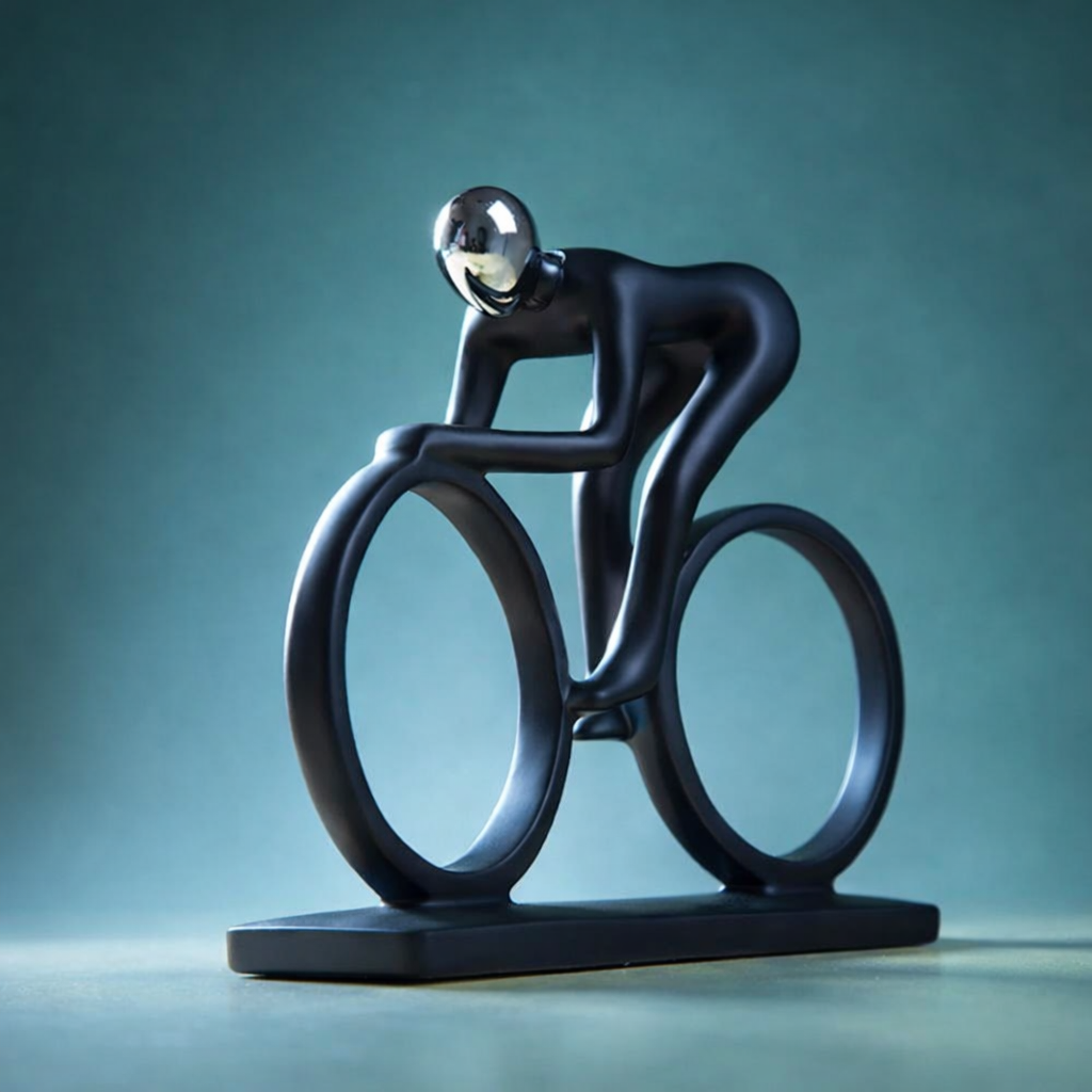 Minimalist cyclist sculpture on blue background