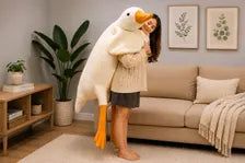 Giant goose plush carried by model
