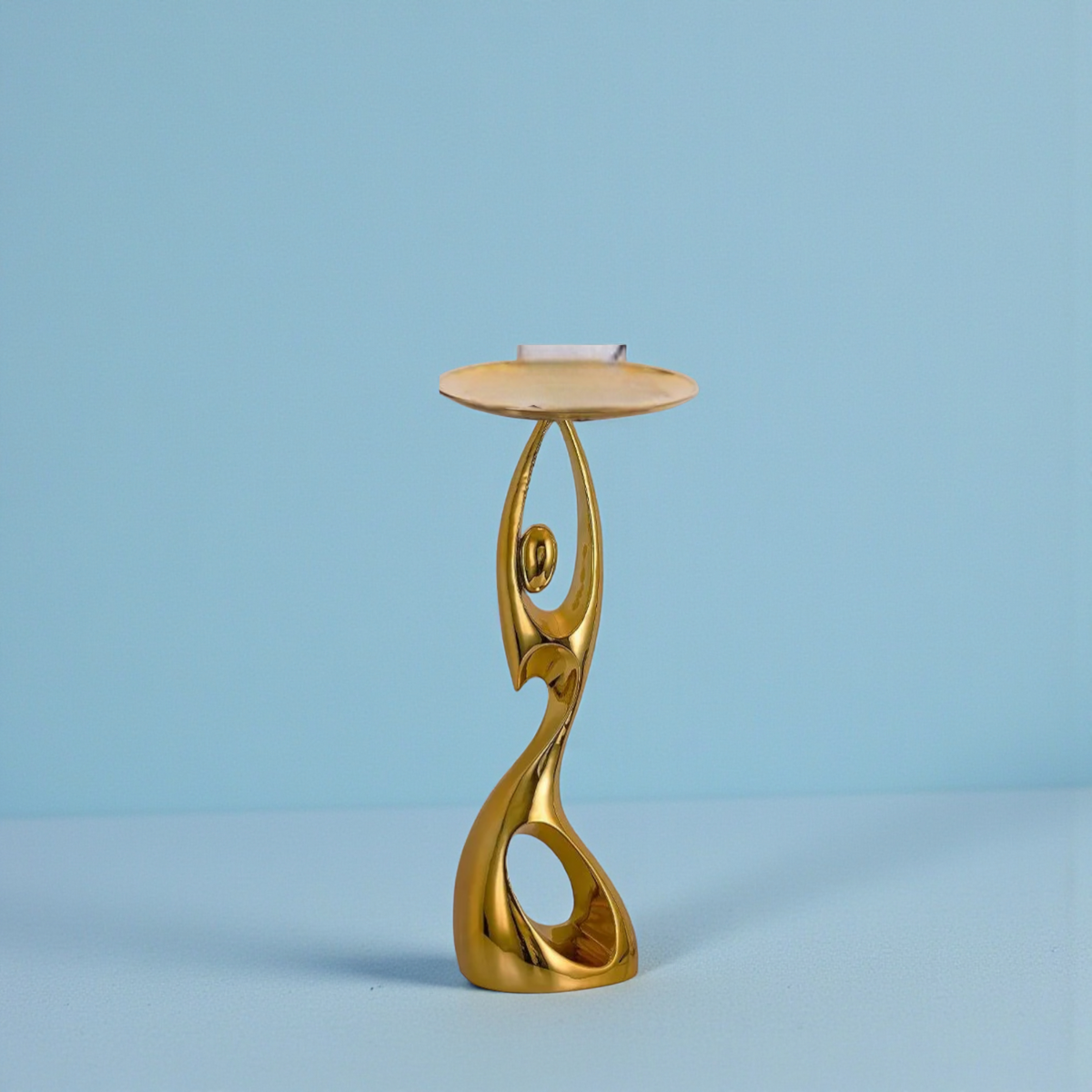 Gold abstract floor sculpture with tray table