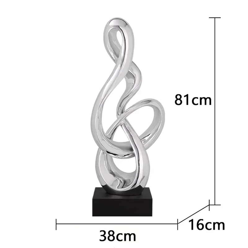 Silver abstract treble clef sculpture size 38 x 16 x 81 cm