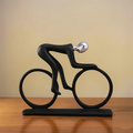 Modern minimalist cyclist sculpture with black bicycle form and metallic head