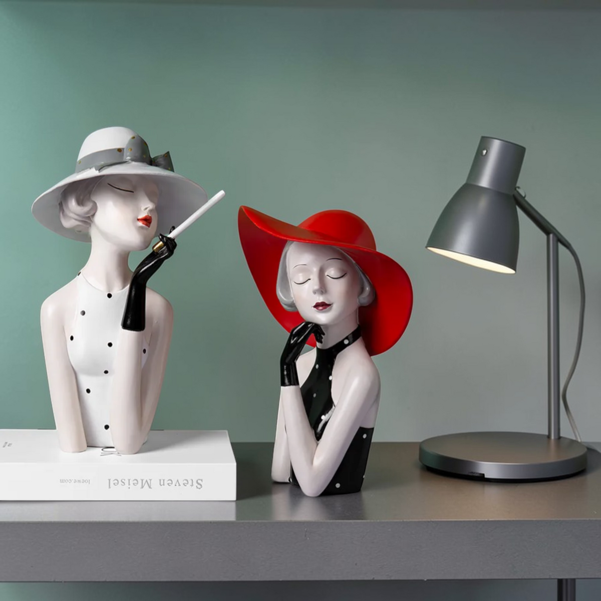 Modern lady sculpture duo styled on a desk