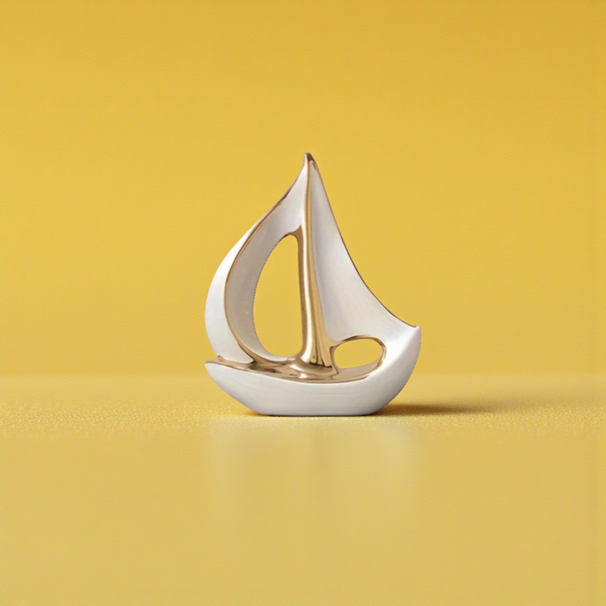 Large modern white and gold ceramic sailboat sculpture