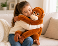 Monkey plush toy hugged by child