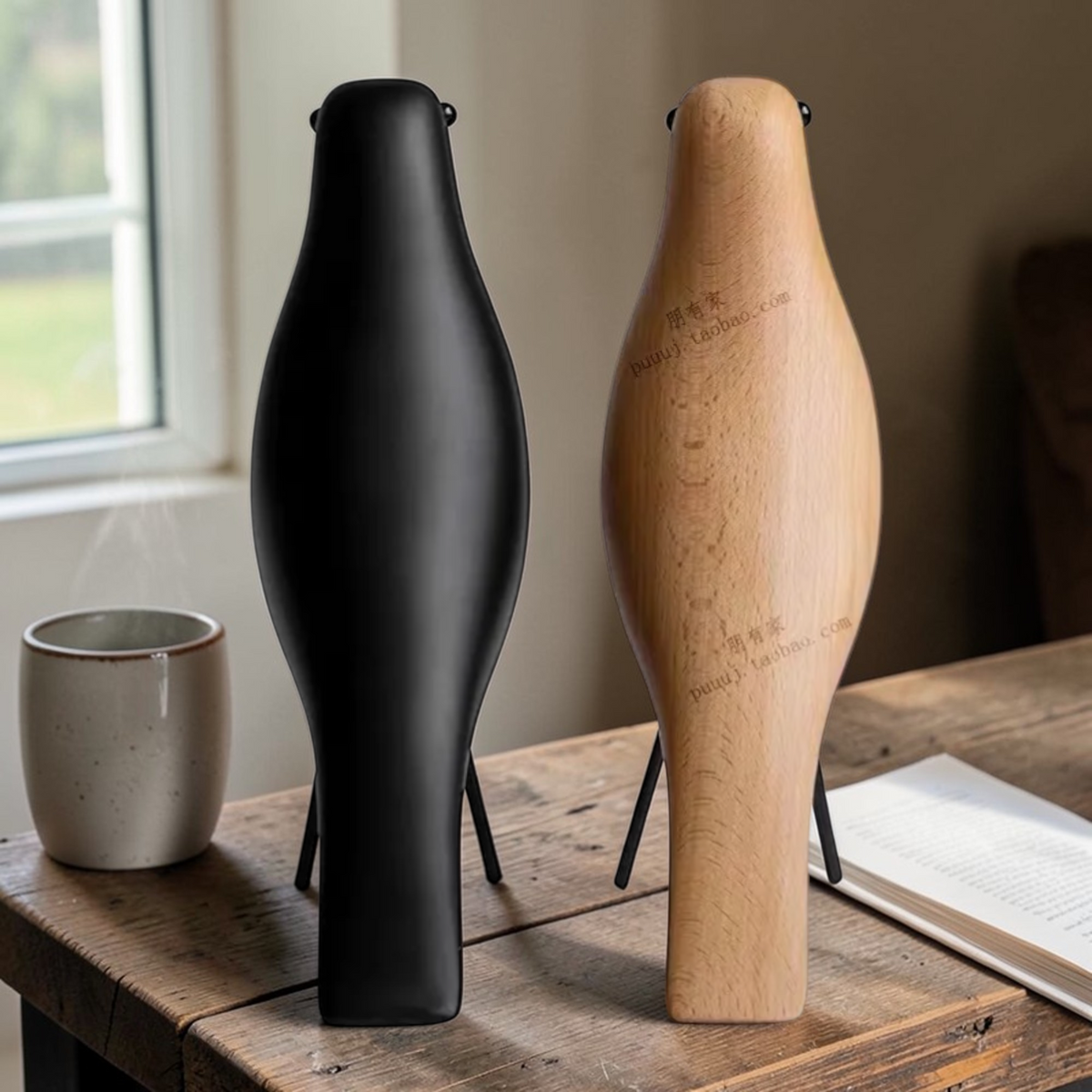 Rear view of black and natural wooden bird ornaments with metal legs