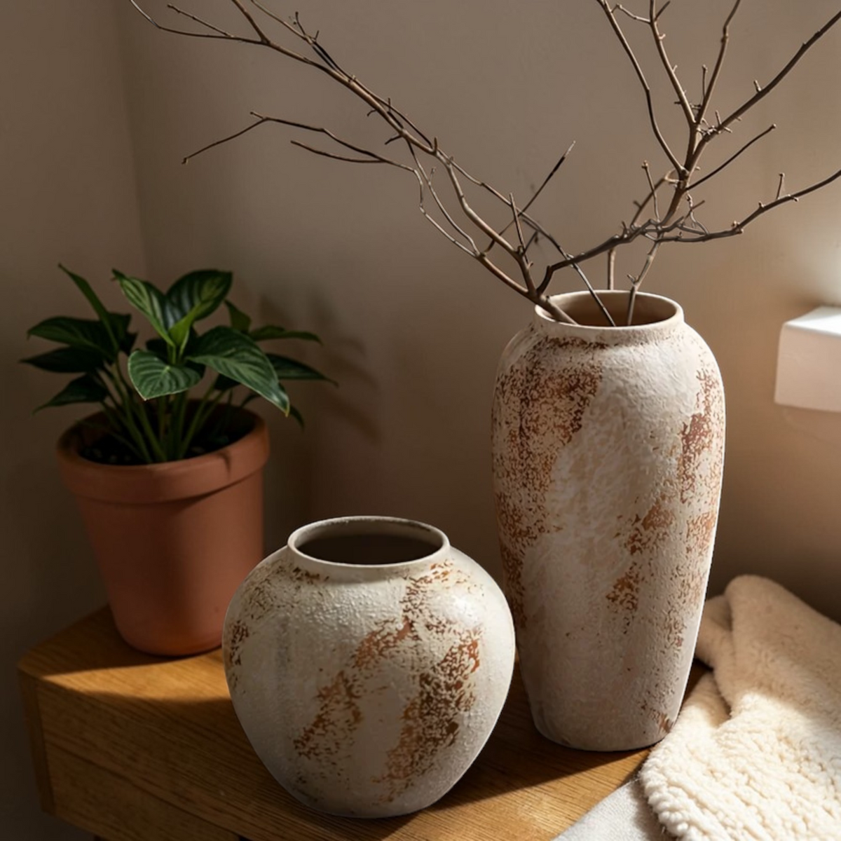 Rustic ceramic vases styled with decorative branches