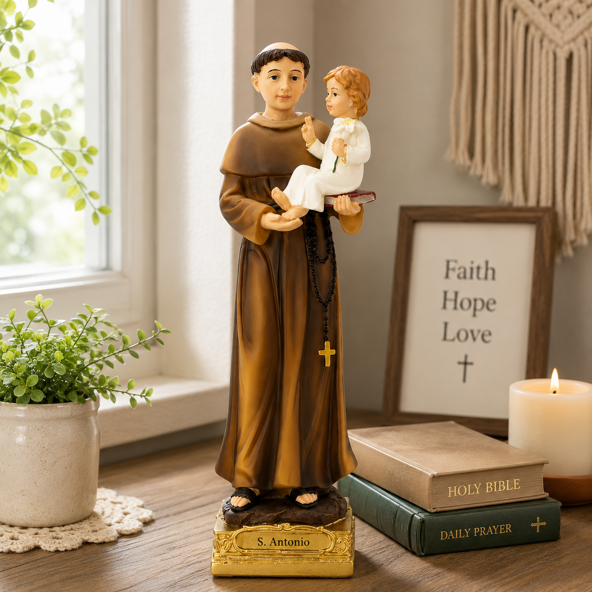 Saint Anthony statue displayed with Bible and candle