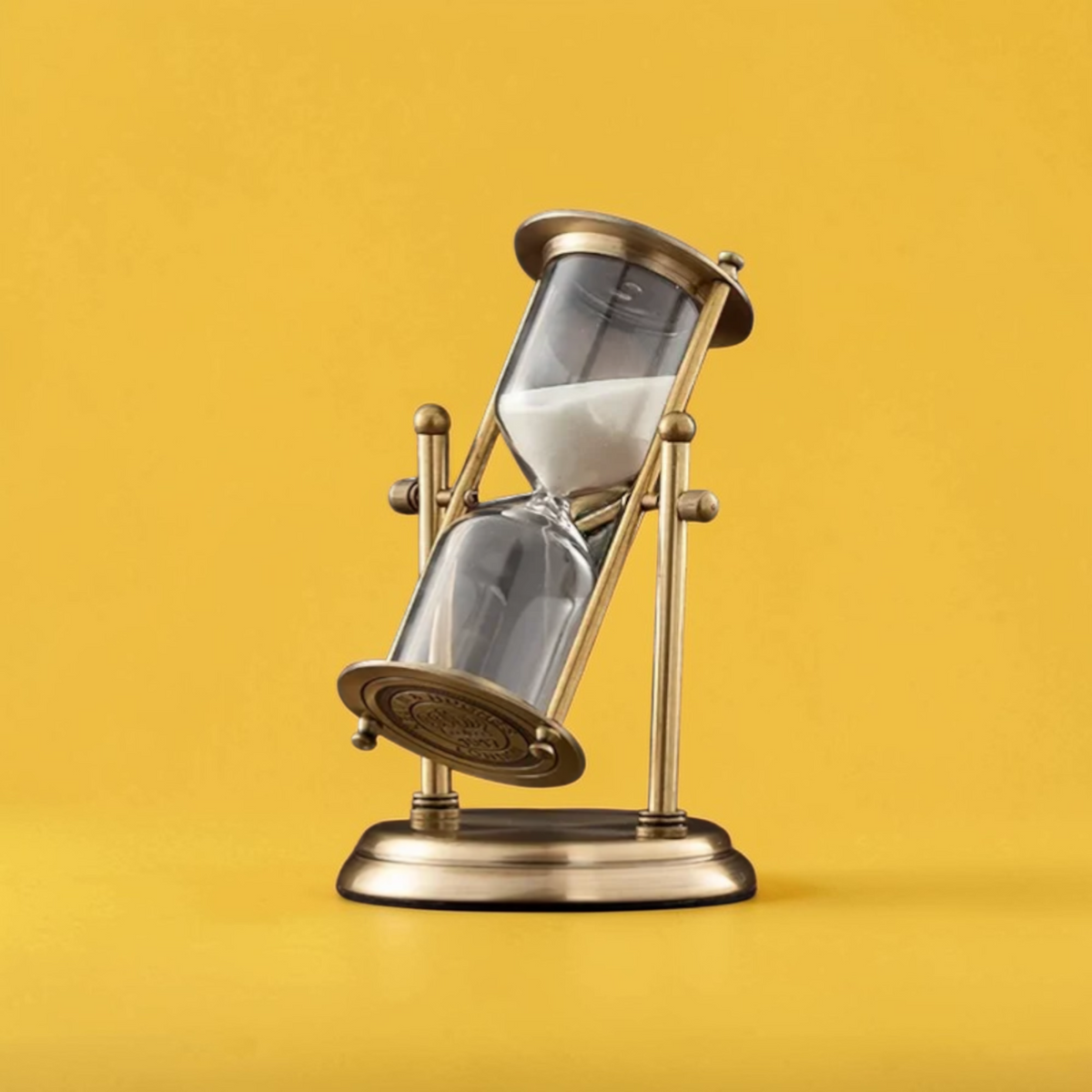 Vintage brass rotating hourglass full view