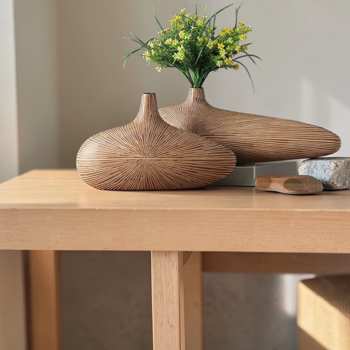 Two light wooden vase styles displayed together